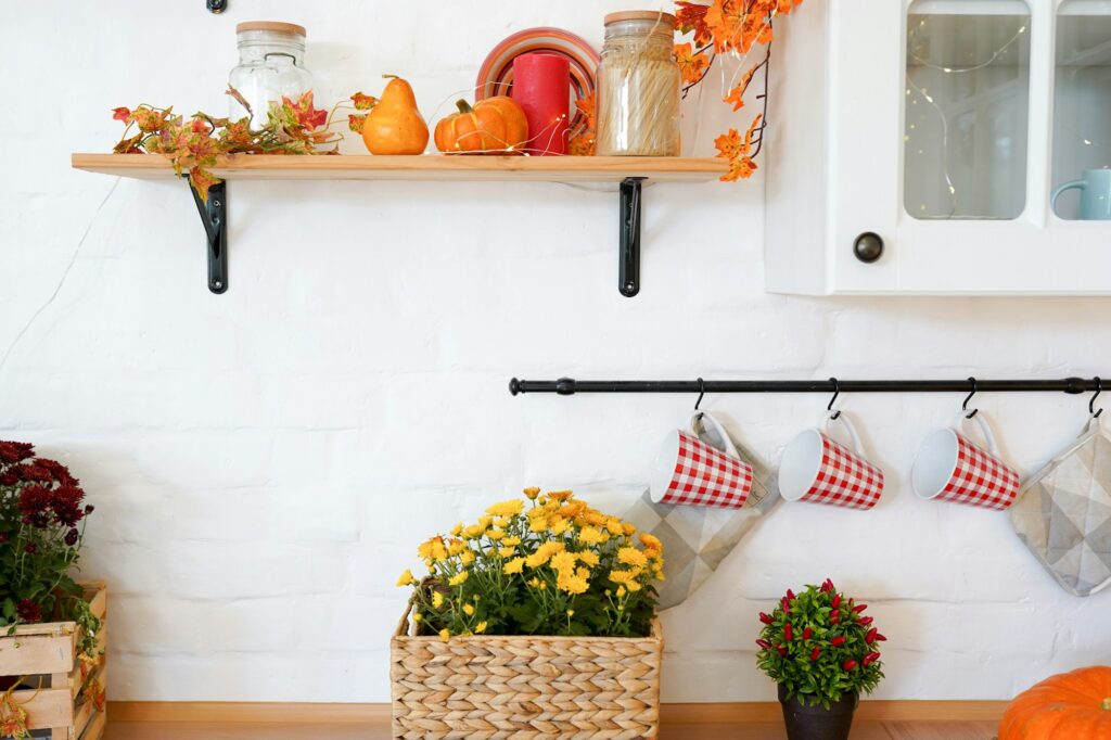 Autumn or fall home interior decor. wooden shelf of white wall